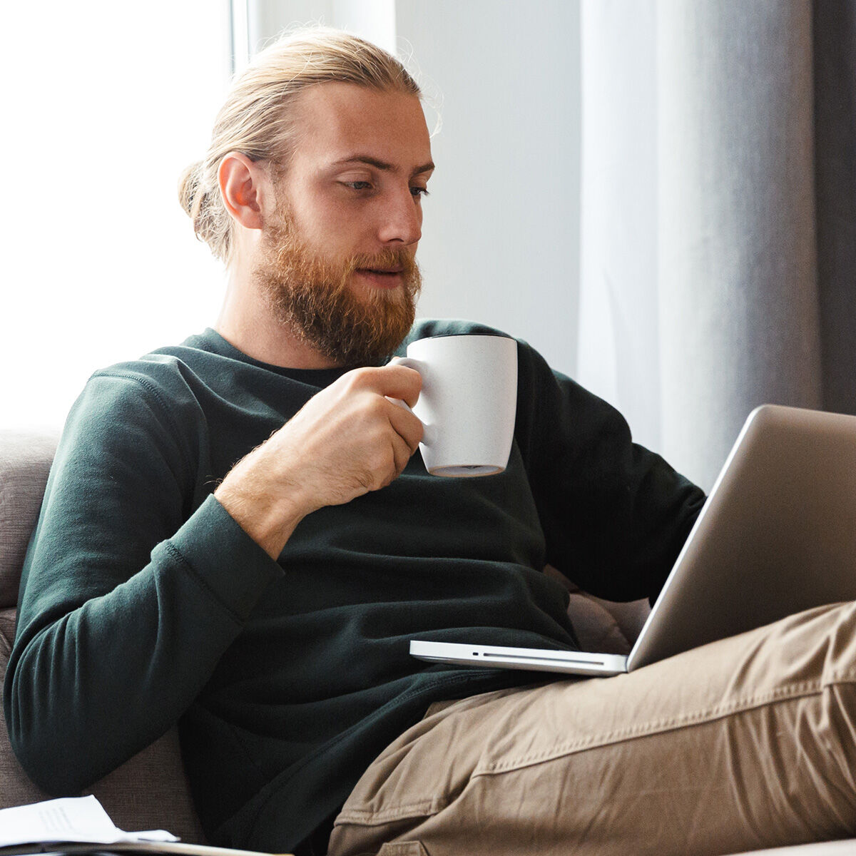 man holding coffee cup
