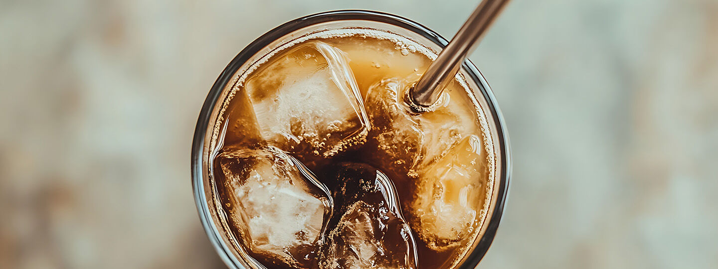 woman smiling and drinking coffee