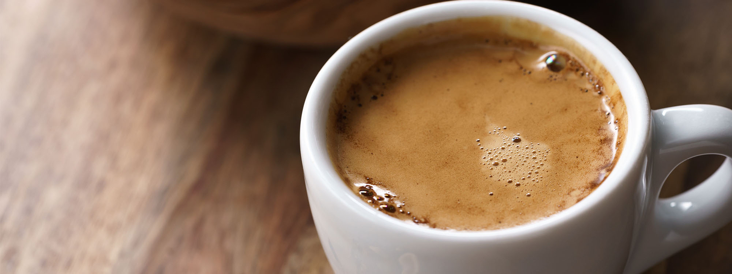 Up-close cup of hot espresso