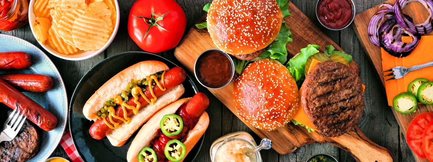 BBQ table spread with hot dogs and burgers