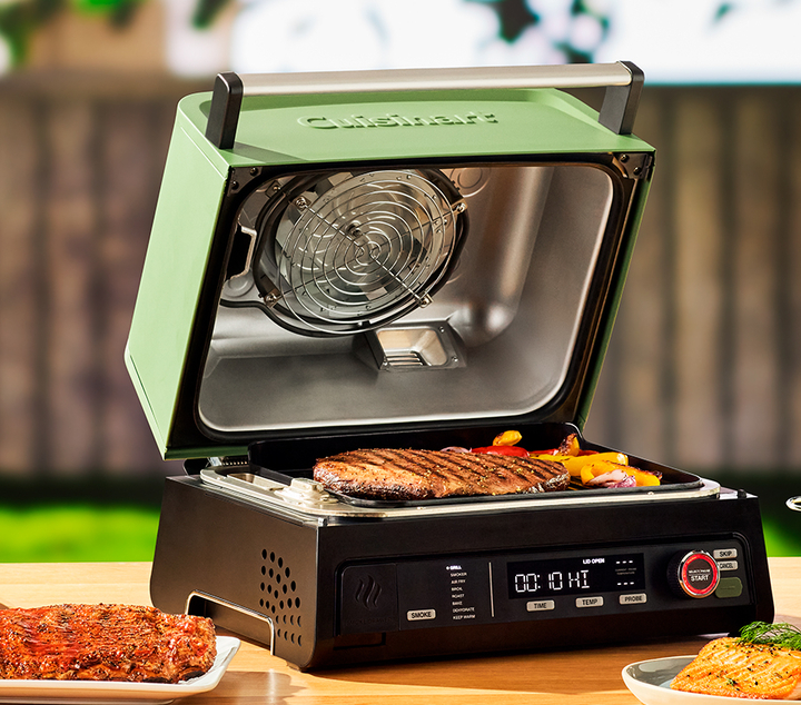 Cuisinart outdoor electric grill with a steak cooking