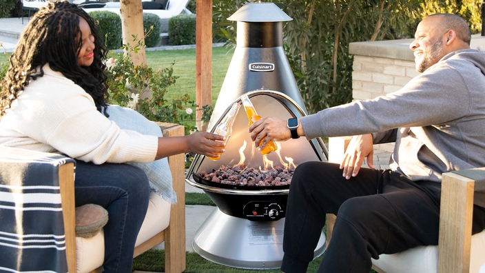 Chimenea Fire pit outside with people sitting by fire