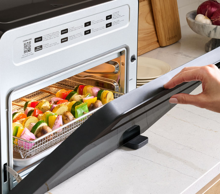Cuisinart digital airfryer with door open and vegetables cooking inside oven