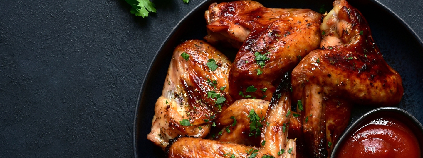 Grilled chicken wings on plate