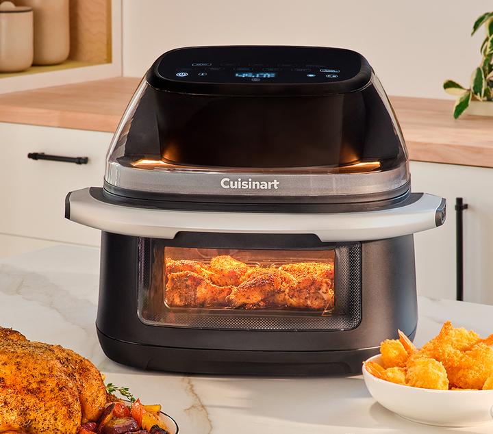 Cuisinart airfryer on countertop cooking fried shrimp