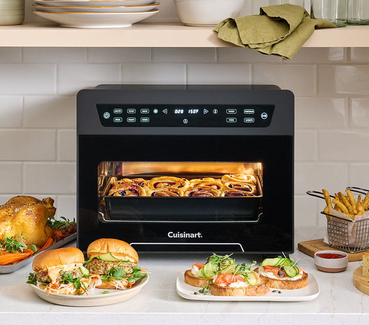 Digital Air Fryer Toaster Oven cooking rolls and sandwiches on plates