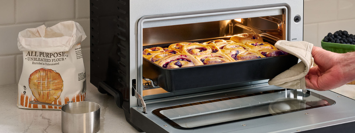 cinnamon rolls coming out of the Cuisinart digital air fryer toaster oven