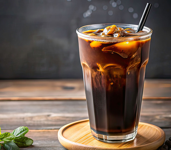Cold brew in glass with straw and ice