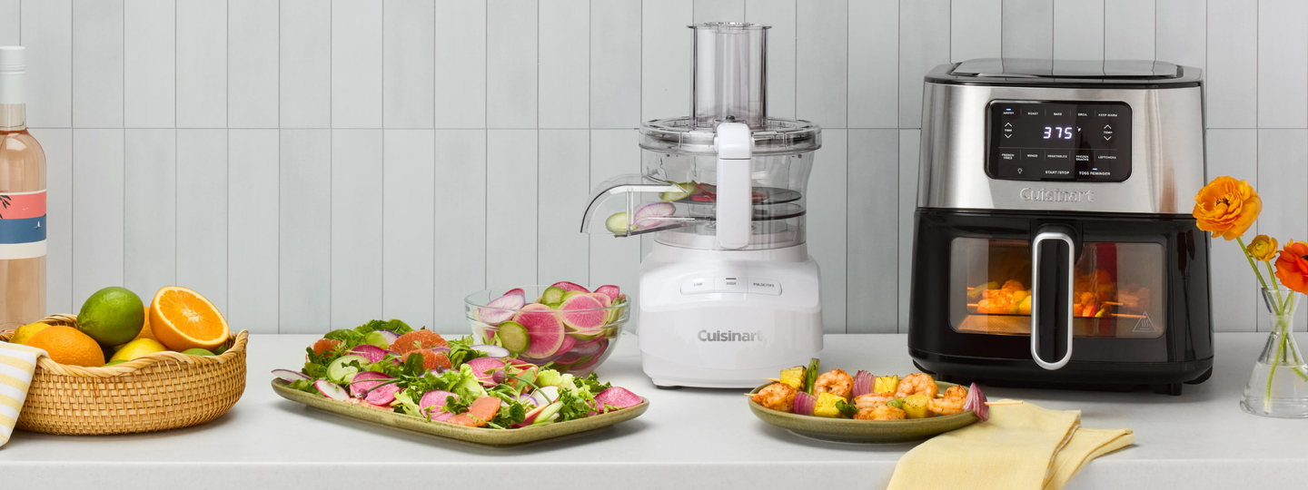 FOOD PROCESSOR AND AIR FRYER WITH DELICIOUS FOOD AROUND IT