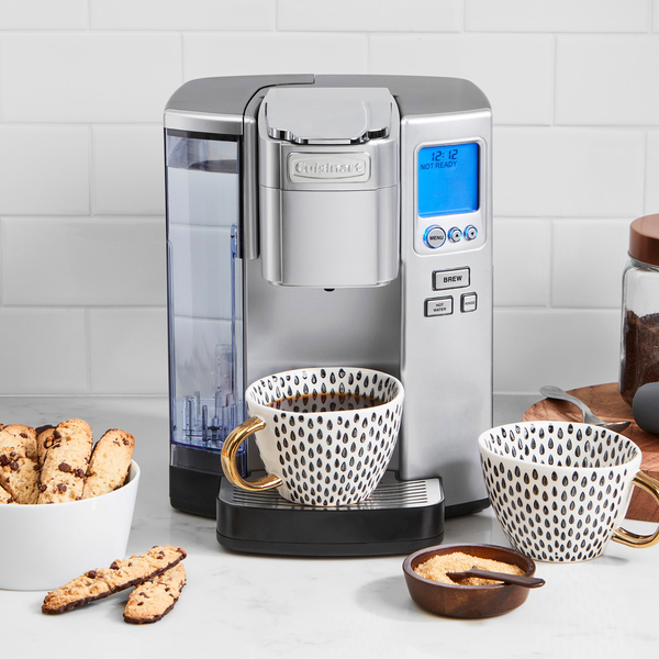 Cuisinart single-serve coffee maker with a cup of coffee and cookies