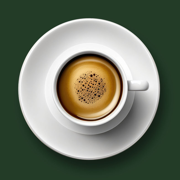 Cup of hot espresso on saucer