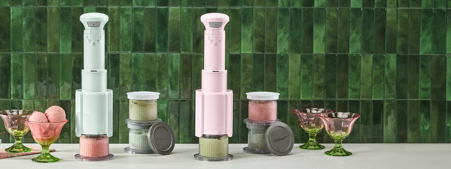 Ice cream makers with containers of ice cream and empty bowls.