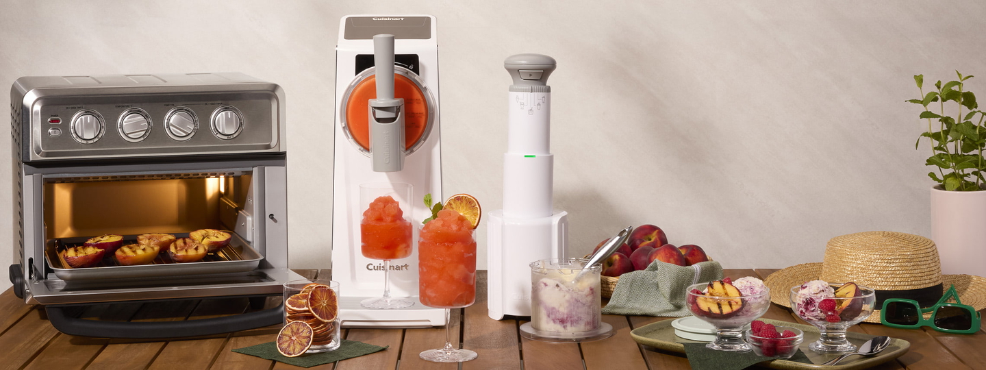 Patio table with toaster oven air fryer, slushy machine, and ice cream maker with treats displayed