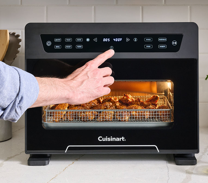 Hand adjusting temperature on Cuisinart Digital Airfryer 
