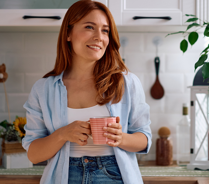 woman holding a cup of coffee