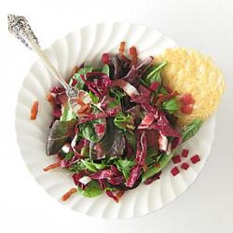 Spring salad with red beet vinaigrette and Parmesan crisp
