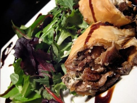 Wild Piedmont Mushroom & Goat Cheese Strudel served over Spring Arugula with toasted Pine Nuts