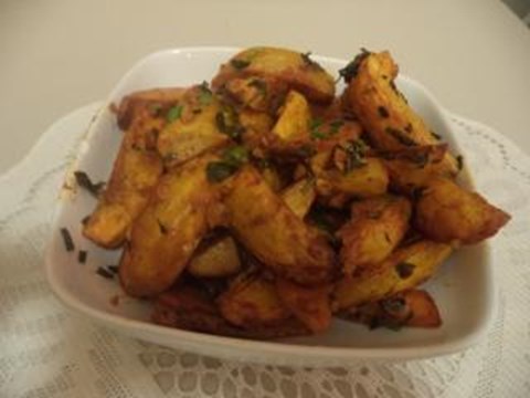 Roasted Gold yukon potatoes in garlic-herb sauce
