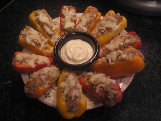 Sweet Mini-Bell Peppers filled with a parmesan and sausage stuffing. Submitted by Nannobear007